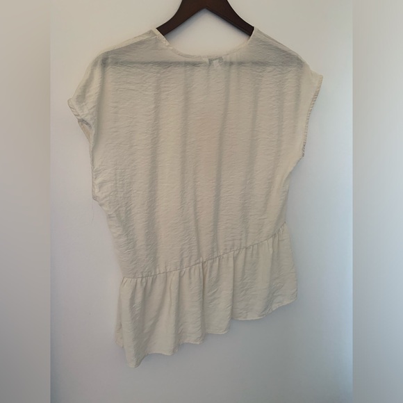 Cream blouse with buttons and slight peplum waist - Picture 2 of 2